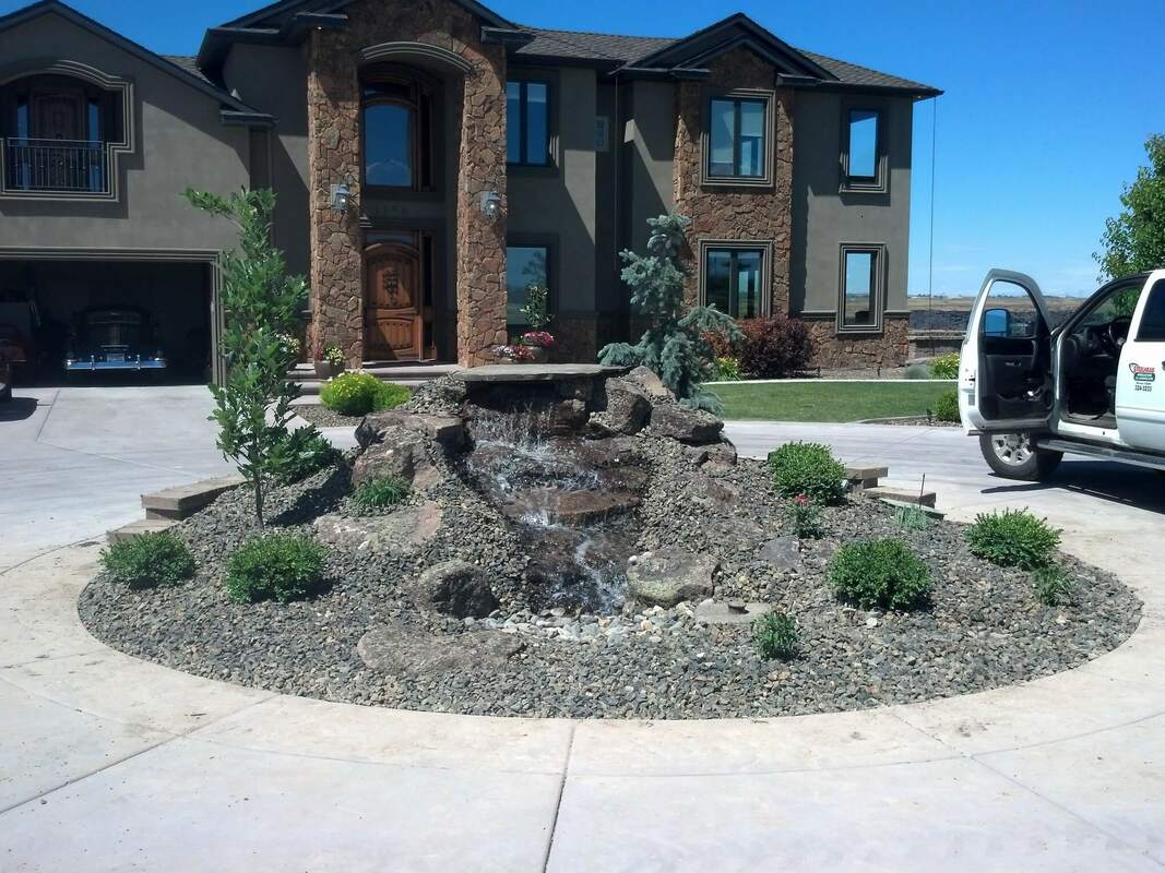 landscaped fountain house in jerome